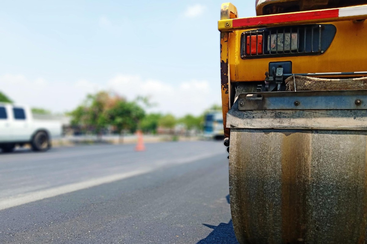 Asphalt paving equipment on an empty road