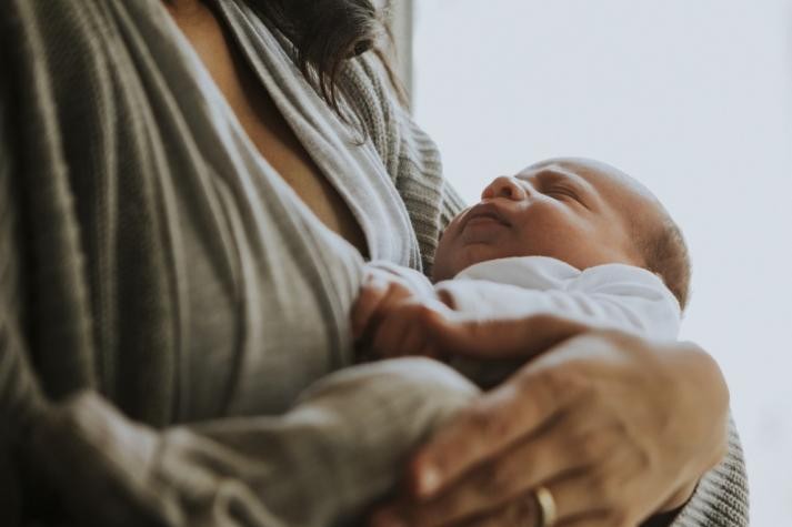 mom holding baby 0